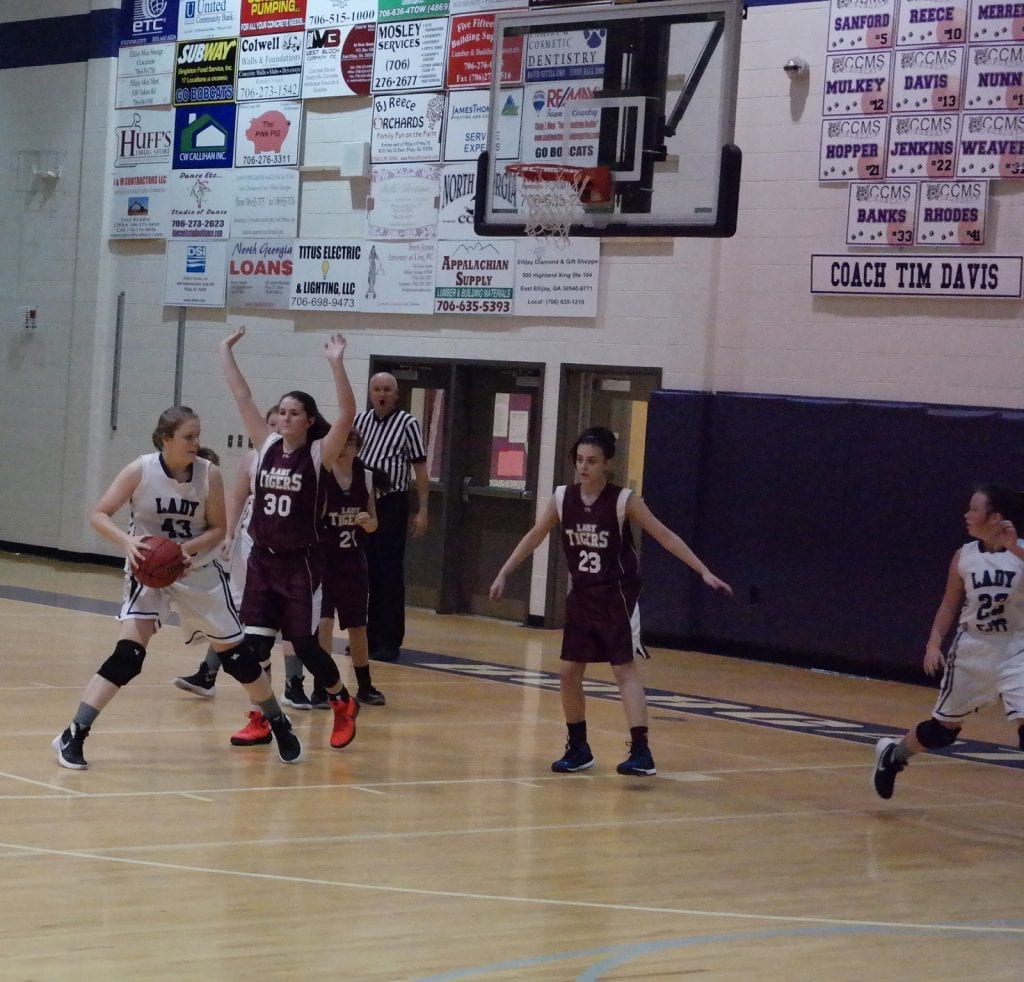 Eighth-grade Lady Cat Dinah Bragg pivots before attempting a post shot against Dawson last night. Along with Bailey Teague and Emma Callihan, she scored a team-leading five points against the Lady Tigers. (Photo by: Kevin Hensley)