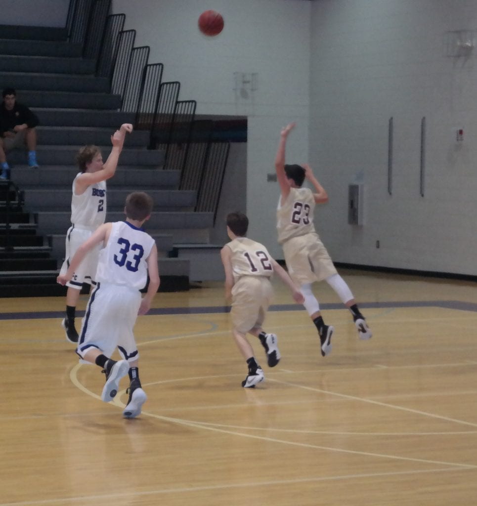 Seventh-grade Bobcat Braden Jenkins shoots for three last Friday against Christian Heritage. He put up 31 points against the Lions. (Photo by: Kevin Hensley)