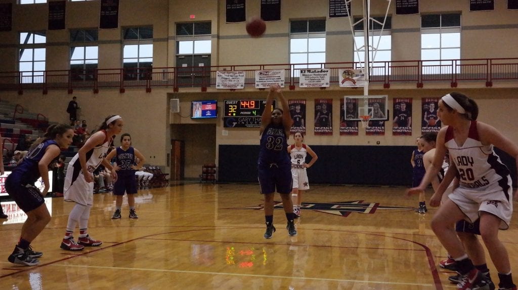 Lady Cat Michaela Staley shoots a free throw at Heritage last Friday. Along with Katie Kiker, she led Gilmer with 12 points in the 35-22 JV victory over the Lady Generals.