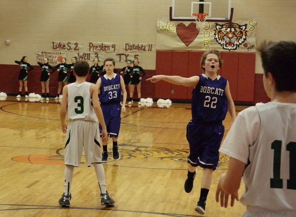 As Ethan Banks (33) prepares to enter the Pickens defense, Braden Jenkins (22) shouts instructions to the Clear Creek offense. Yesterday at Dawson County Middle School, the Bobcats bested the Dragons 19-18, to advance to the seventh-grade boys North Georgia Mountain League championship game. (Photo by: Kevin Hensley).