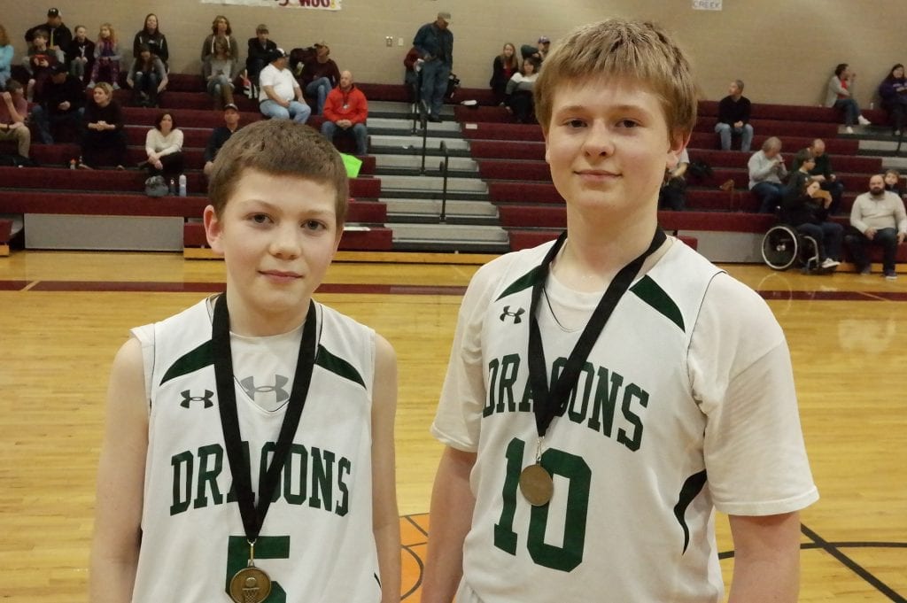 After the Clear Creek/Pickens contest, the Dragons recognized Clay Shoffer (left) as their Academic Award winner and Dawson Turner (right) as their All-Tournament selection. (Photo by: Kevin Hensley)