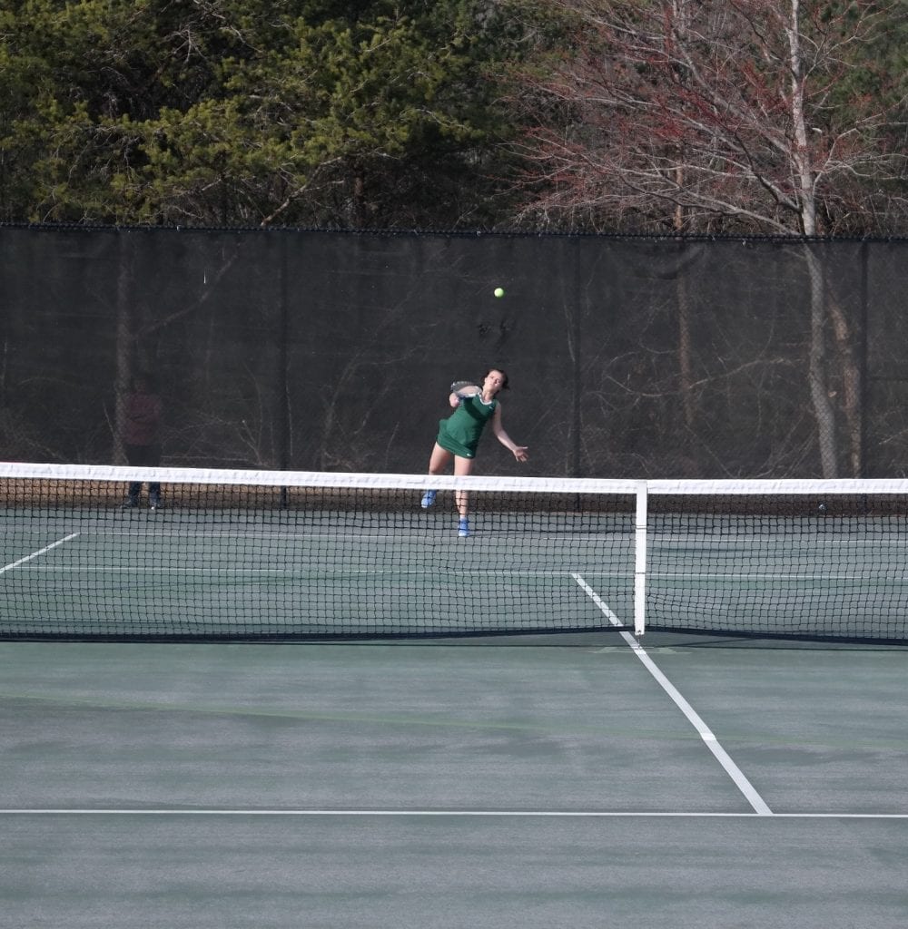 Lady Indian Meredith Page serves the ball to Ally Davis Monday at Gilmer. Page bested Davis 8-1, to pick up the only girls win for Murray County. (Photo by: Kevin Hensley)