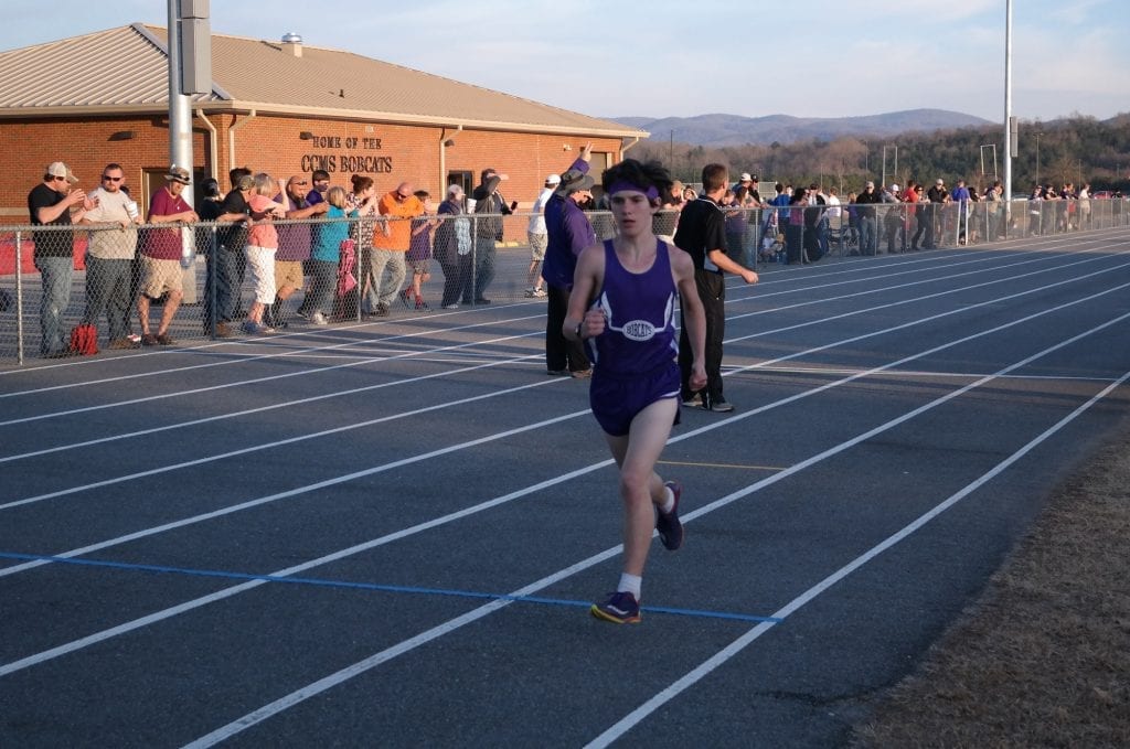 Jakob Dobbs sprints through another lap last Tuesday against Lumpkin. Dobbs won both the 1,600 and 3,200-meter runs for Clear Creek. (Photo by: Kevin Hensley)