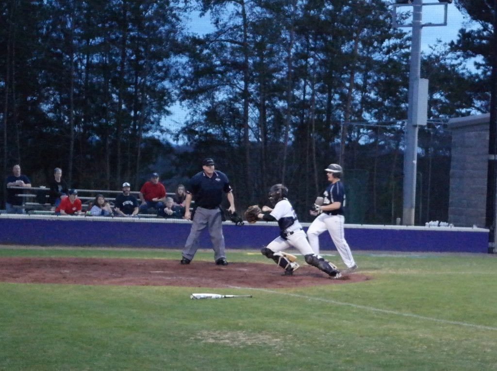 JV Bobcat catcher Koby Allen scrambles to cover home, during a fielder's choice in the top of the third inning last Friday against White County. Allen beat Warrior Nash Vandiver to the plate to record the first out of the inning and the Bobcats overcame a six-run deficit that was brought on in that same inning to remain unbeaten and defeat White County, 11-9. (Photo by: Kevin Hensley)