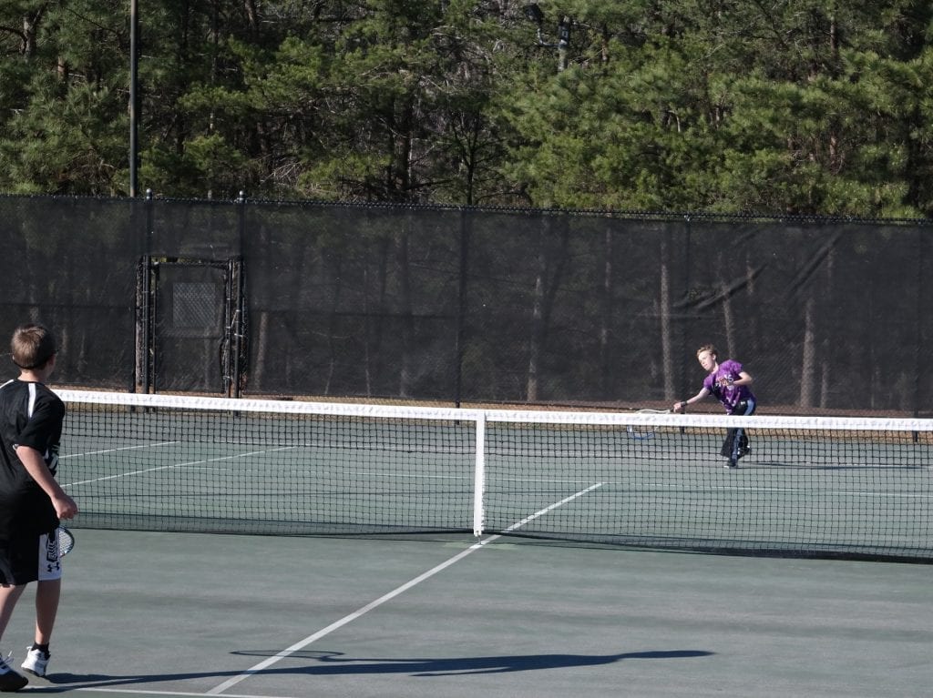 Bobcat Brady Sanford reaches for a return last Tuesday against Pickens. Sanford traveled to Fannin the next day and picked up an 8-3 victory. (Photo by: Kevin Hensley)