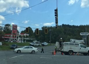 Officers direct traffic during the replacement of traffic lights at East Ellijay's 1st Avenue and 515 intersection.